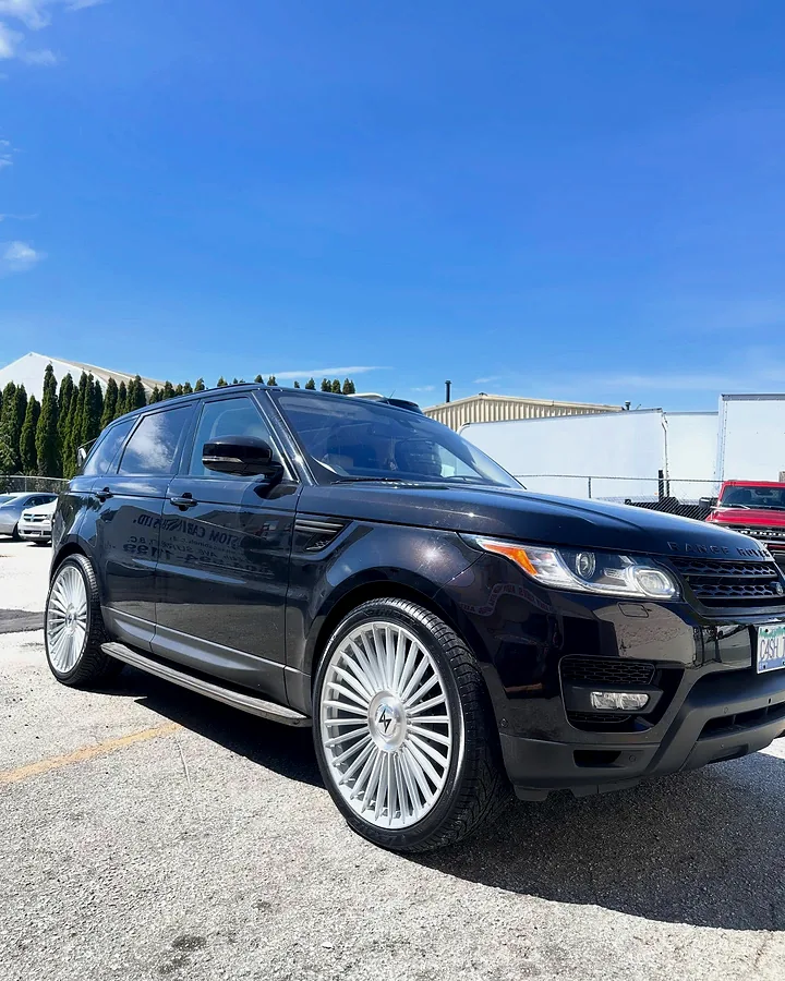 Black Range Rover Sport on large polished wheels