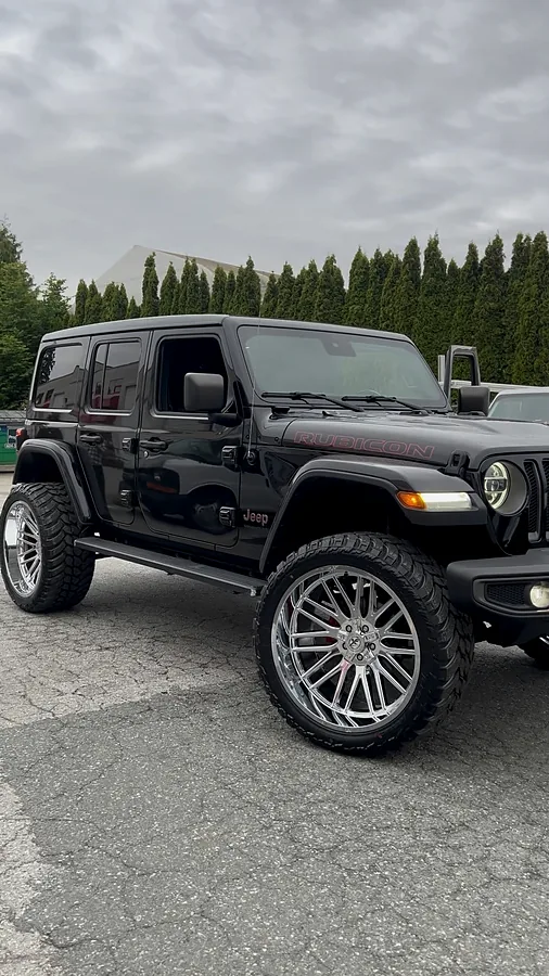 Grey Jeep Wrangler on polished split-spoke wheels